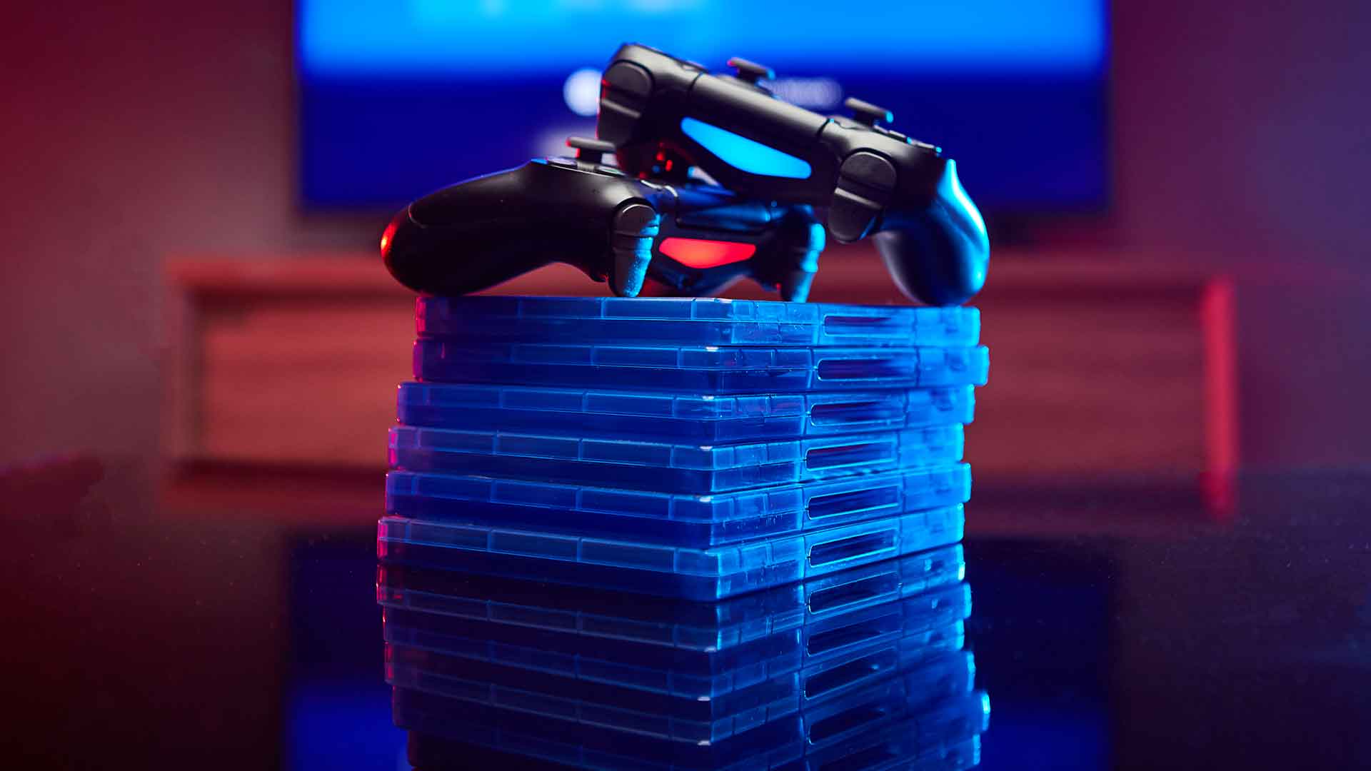 manette jeu vidéo sur pile de cd